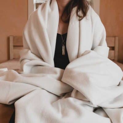 Shepherd's Dream Merino Wool Blanket Lifestyle Draped Over Someone
