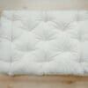 Shepherd's Dream EcoWool Pet Bed without cover on hardwood floor.