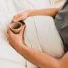Ashland Organic Wool Comforter with man holding coffee mug.