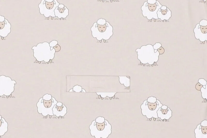 Sheep print on light beige background