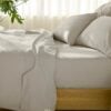 Bedroom with Organic cotton percale sheet set in stone grey