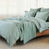 Bedroom with organic cotton percale sheet set in seafoam green