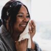 Woman holding a cotton face towel