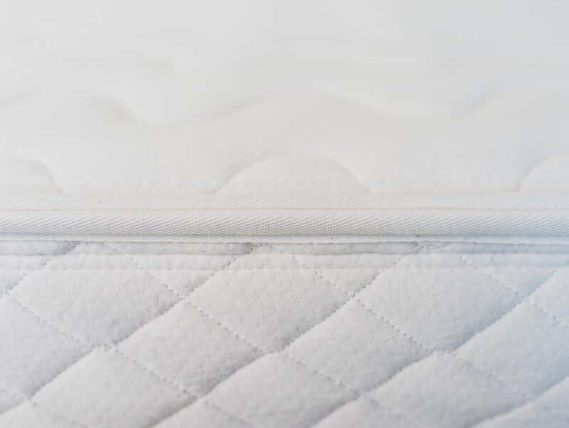 Zipper detail image of organic cotton cover on organic wool mattress.