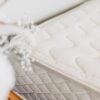 Detail image of mattress corner showing texture of organic cotton cover.