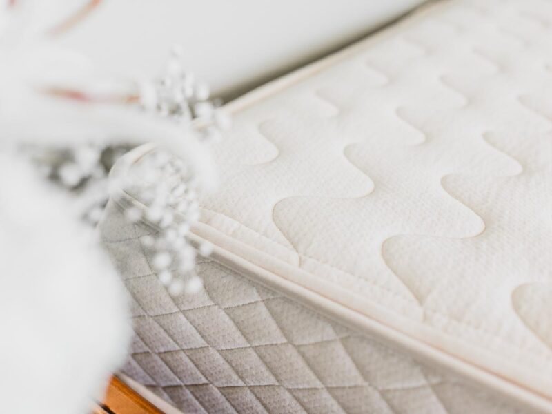 Detail image of mattress corner showing texture of organic cotton cover.