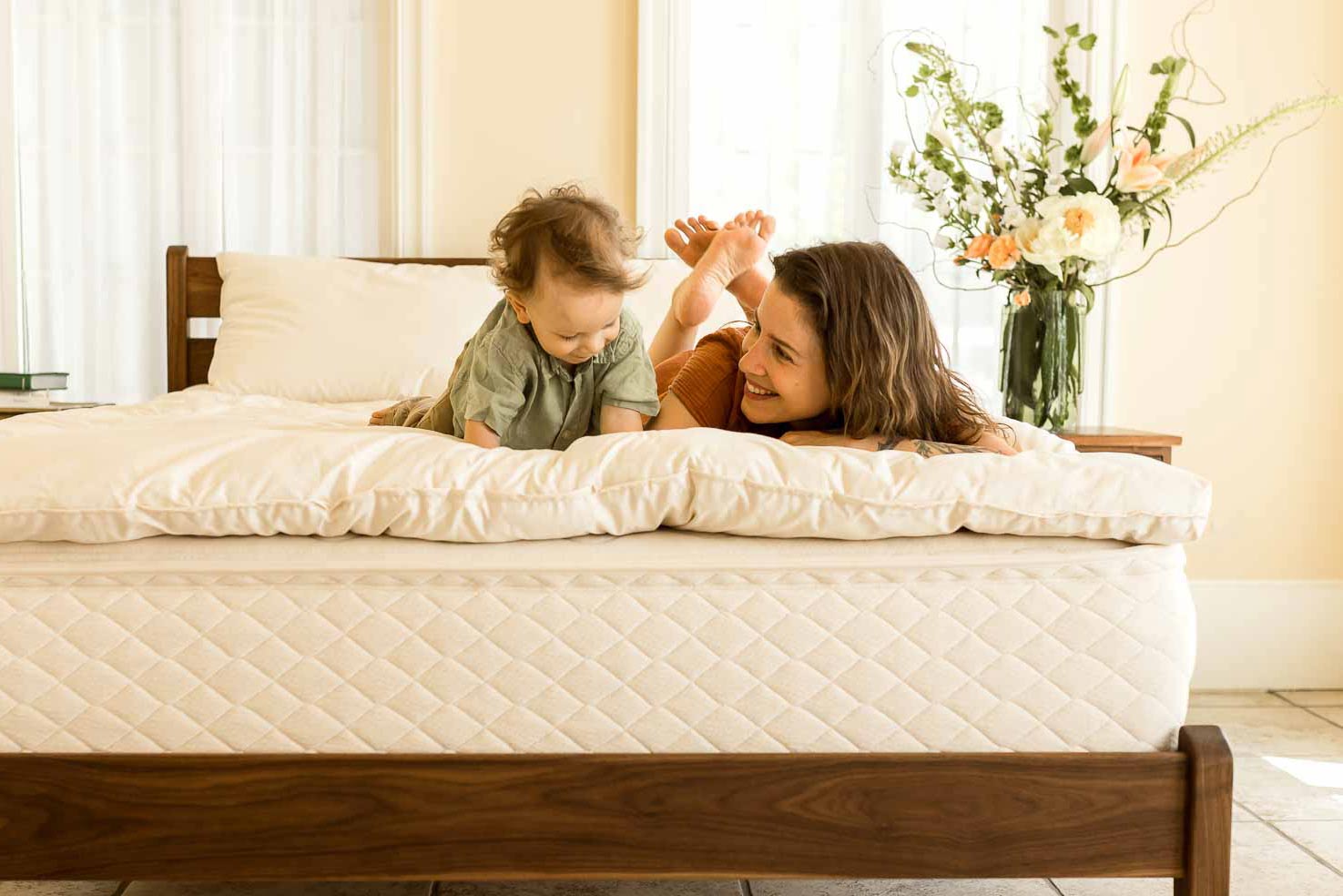 Mother and son on a natural latex mattress