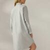 Woman wearing a gray organic cotton flannel nightshirt