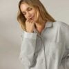Woman wearing a gray organic cotton flannel nightshirt