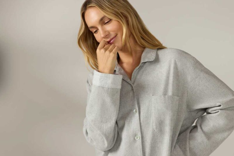 Woman wearing a gray organic cotton flannel nightshirt