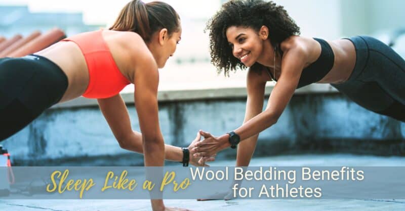 Two women exercise facing each other and shake hands while holding a plank position.