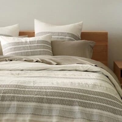 Bedroom with organic duvet cover in white with graphite stripes