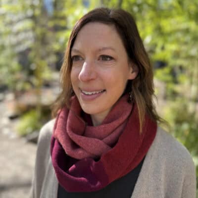 Woman wearing a red lambswool infinity scarf